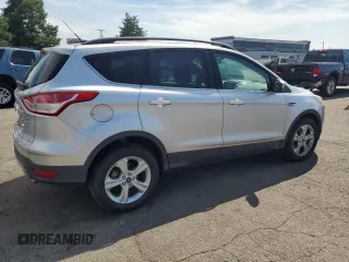 2014 Ford Escape SE with VIN 1FMCU9GX3EUB19987, listed as a Copart auction lot 64042695 with 96,775 mi miles and Salvage title. Bid and sale history available at DreamBid. Image 3.