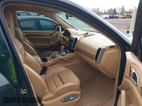 2012 Porsche Cayenne S Hybrid z VIN WP1AE2A20CLA92813, wystawiony jako IAAI lot #41916936 z przebiegiem 145 503 mil mil oraz . Historia ofert i sprzedaży dostępna na DreamBid. Obrazek 5.