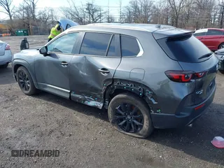 2025 Mazda CX-50 S Premium with VIN 7MMVABDM0SN316760, listed as a IAAI auction lot 41864360 with 6,555 mi miles and . Bid and sale history available at DreamBid. Image 3.