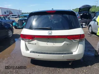 2014 Honda Odyssey Touring with VIN 5FNRL5H94EB071788, listed as a IAAI auction lot 42523959 with 244,734 mi miles and . Bid and sale history available at DreamBid. Image 16.
