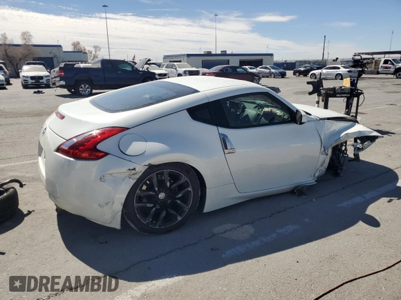 2014 Nissan 370Z Nismo with VIN JN1AZ4EH2EM633022, listed as a Copart auction lot 46947575 with 115,042 mi miles and Salvage Title. Bid and sale history available at DreamBid. Image 3.
