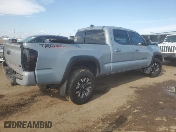 2021 Toyota Tacoma SR5 with VIN 3TMDZ5BN9MM099515, listed as a Copart auction lot 56687385 with 66,721 mi miles and Salvage title. Bid and sale history available at DreamBid. Image 3.