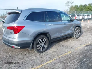 2016 Honda Pilot Touring with VIN 5FNYF6H90GB024902, listed as a IAAI auction lot 41948563 with 148,598 mi miles. Bid and sale history available at carsss.com. Image 4.