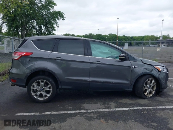 2013 Ford Escape SEL z VIN 1FMCU9H96DUC66206, wystawiony jako IAAI lot #42376442 z przebiegiem 96 776 mil mil oraz . Historia ofert i sprzedaży dostępna na DreamBid. Obrazek 13.