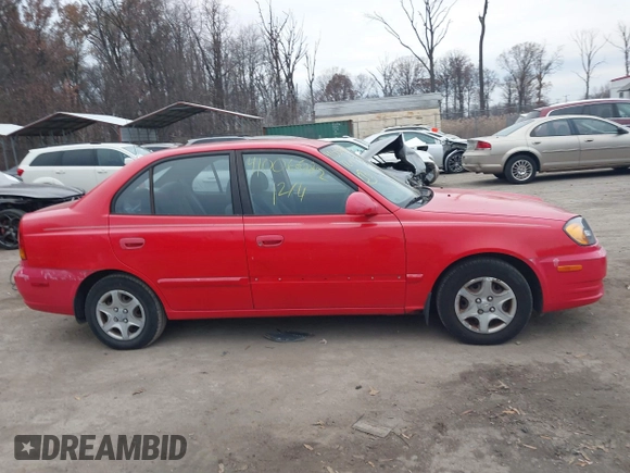 2005 Hyundai Accent GLS with VIN KMHCG45CX5U614083, listed as a IAAI auction lot 41006582 with 72,516 mi miles. Bid and sale history available at carsss.com. Image 13.