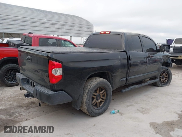 2014 Toyota Tundra 4WD Truck SR with VIN 5TFUM5F14EX051843, listed as a IAAI auction lot 41773983 with 145,089 mi miles. Bid and sale history available at carsss.com. Image 4.
