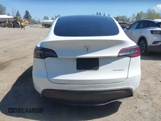 2022 Tesla Model Y Long Range z VIN 7SAYGDEE7NF418223, wystawiony jako IAAI lot #42046651 z przebiegiem 18 724 mil mil oraz . Historia ofert i sprzedaży dostępna na DreamBid. Obrazek 17.