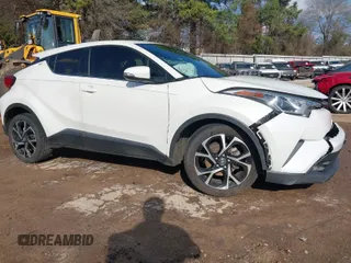 2019 Toyota C-HR XLE with VIN JTNKHMBX2K1041838, listed as a IAAI auction lot 41511513 with 107,145 mi miles. Bid and sale history available at carsss.com. Image 1.