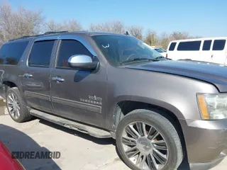 2011 Chevrolet Suburban LT with VIN 1GNSCJE03BR381301, listed as a IAAI auction lot 41412636 with 243,601 mi miles. Bid and sale history available at carsss.com. Image 1.