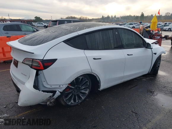 2021 Tesla Model Y Performance z VIN 5YJYGDEF2MF133739, wystawiony jako IAAI lot #41226429 z przebiegiem 58 502 mil mil oraz . Historia ofert i sprzedaży dostępna na DreamBid. Obrazek 4.