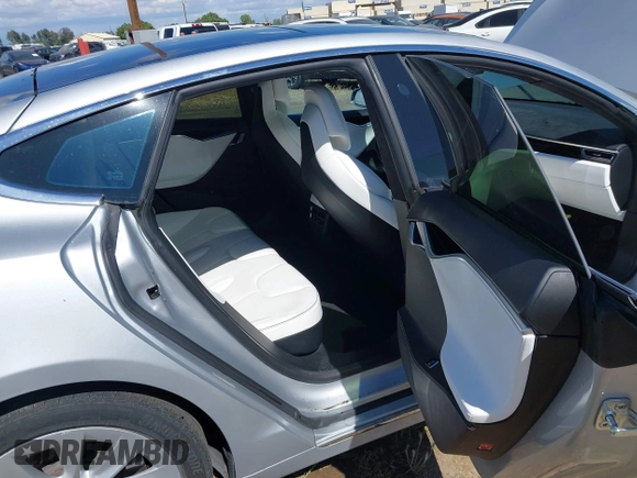 2016 Tesla Model S 90D with VIN 5YJSA1E22GF174637, listed as a IAAI auction lot 42234083 with 142,915 mi miles and . Bid and sale history available at DreamBid. Image 8.