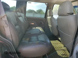 1997 GMC Yukon with VIN 1GKEK13R7VJ711782, listed as a Copart auction lot 74793184 with 208,718 mi miles and Salvage Title. Bid and sale history available at carsss.com. Image 12.