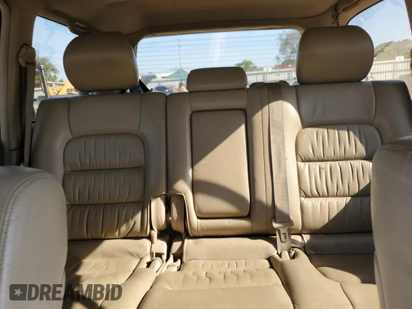 2002 Lexus LX 470 z VIN JTJHT00W723519186, wystawiony jako Copart lot #70190464 z przebiegiem 306 793 mil mil oraz Tytuł czysty. Historia ofert i sprzedaży dostępna na DreamBid. Obrazek 10.