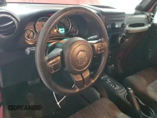2012 Jeep Wrangler Sport with VIN 1C4AJWAG5CL233049, listed as a Copart auction lot 52328865 with 185,388 mi miles and Salvage title. Bid and sale history available at DreamBid. Image 8.