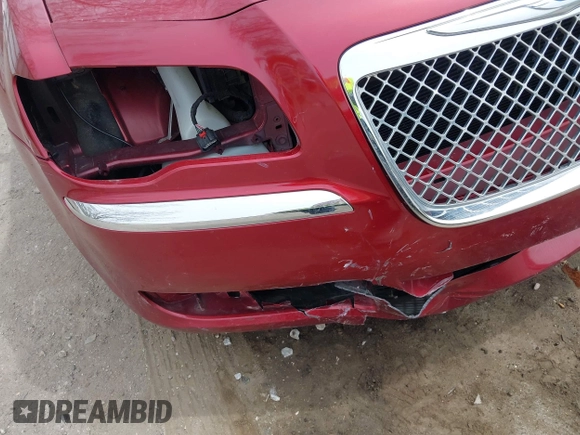 2012 Chrysler 300 C with VIN 2C3CCAKTXCH220185, listed as a IAAI auction lot 42110327 with 57,682 mi miles and . Bid and sale history available at DreamBid. Image 18.