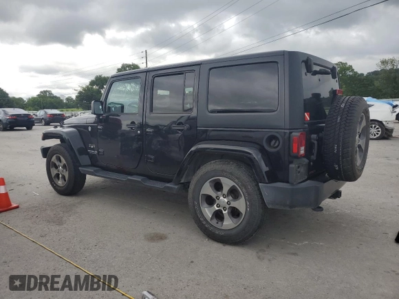 2017 Jeep Wrangler Unlimited Sahara with VIN 1C4BJWEG9HL633296, listed as a Copart auction lot 61387685 with 74,035 mi miles and Salvage title. Bid and sale history available at DreamBid. Image 2.