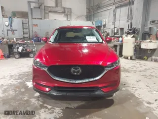 2021 Mazda CX-5 Touring with VIN JM3KFACM3M0331597, listed as a IAAI auction lot 41687333 with 68,562 mi miles. Bid and sale history available at carsss.com. Image 12.