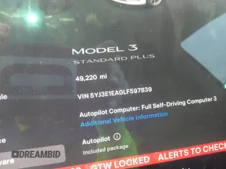 2020 Tesla Model 3 Standard Range Plus with VIN 5YJ3E1EA0LF597839, listed as a IAAI auction lot 41639219 with 49,220 mi miles. Bid and sale history available at carsss.com. Image 7.