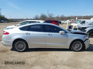 2014 Ford Fusion Titanium Hybrid with VIN 3FA6P0RU9ER147443, listed as a IAAI auction lot 41739540 with 146,359 mi miles. Bid and sale history available at carsss.com. Image 14.