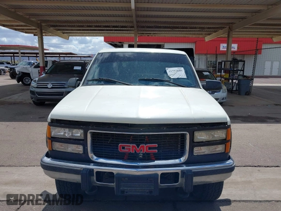 1995 GMC Sierra 1500 z VIN 2GTEK19K9S1591415, wystawiony jako IAAI lot #41793889 z przebiegiem 334 435 mil mil oraz . Historia ofert i sprzedaży dostępna na DreamBid. Obrazek 6.