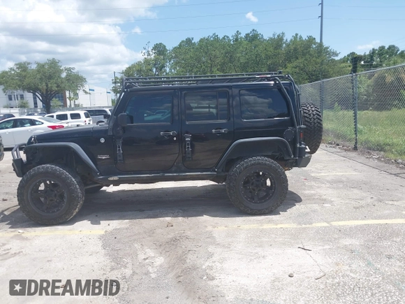 2012 Jeep Wrangler Unlimited Altitude with VIN 1C4HJWEG5CL161049, listed as a IAAI auction lot 42629330 with 217,147 mi miles and . Bid and sale history available at DreamBid. Image 14.