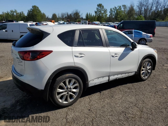 2014 Mazda CX-5 Grand Touring with VIN JM3KE4DY2E0354795, listed as a Copart auction lot 54205775 with 62,939 mi miles and Salvage Title. Bid and sale history available at DreamBid. Image 3.