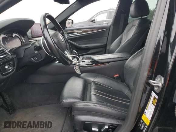 2019 BMW 5 Series 540i xDrive with VIN WBAJE7C54KWW19994, listed as a Copart auction lot 57973055 with 121,995 mi miles and Salvage title. Bid and sale history available at DreamBid. Image 7.