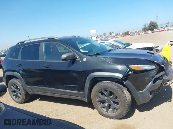 2016 Jeep Cherokee Trailhawk with VIN 1C4PJMBB9GW179051, listed as a IAAI auction lot 42520342 with 100,538 mi miles and . Bid and sale history available at DreamBid. Image 13.