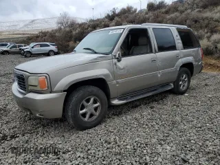 2000 Cadillac Escalade z VIN 1GYEK13RXYR103671, wystawiony jako Copart lot #48146125 z przebiegiem 271 195 mil mil oraz Szkoda całkowita • Salvage title. Historia ofert i sprzedaży dostępna na DreamBid. Obrazek 1.