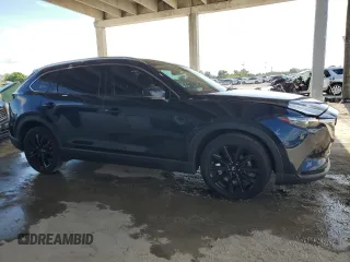 2022 Mazda CX-9 Touring Plus with VIN JM3TCBAYXN0607056, listed as a Copart auction lot 61740065 with 59,281 mi miles and Salvage title. Bid and sale history available at DreamBid. Image 4.
