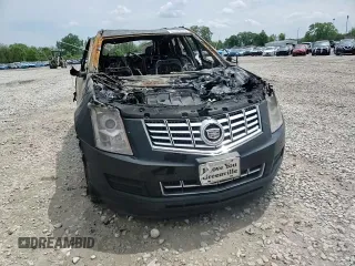 2015 Cadillac SRX Luxury Collection z VIN 3GYFNBE31FS612780, wystawiony jako Copart lot #56149815 z przebiegiem Nie podano mil oraz Nie do naprawy • Non repairable. Historia ofert i sprzedaży dostępna na DreamBid. Obrazek 13.