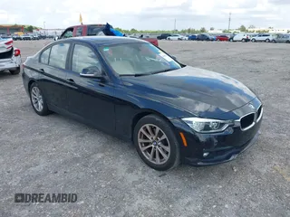 2018 BMW 3 Series 320i with VIN WBA8E1G57JNU88781, listed as a IAAI auction lot 42019246 with 56,820 mi miles. Bid and sale history available at carsss.com. Image 1.