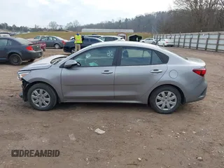 2023 Kia Rio LX z VIN 3KPA24AD7PE520723, wystawiony jako IAAI lot #41184281 z przebiegiem 11 971 mil mil oraz . Historia ofert i sprzedaży dostępna na DreamBid. Obrazek 14.
