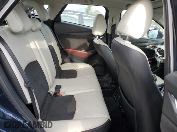 2017 Mazda CX-3 Grand Touring z VIN JM1DKFD75H0141048, wystawiony jako Copart lot #55752185 z przebiegiem 89 960 mil mil oraz Szkody całkowita. Historia ofert i sprzedaży dostępna na DreamBid. Obrazek 11.