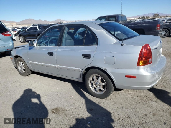 2003 Hyundai Accent GL z VIN KMHCG45C63U413388, wystawiony jako Copart lot #88979235 z przebiegiem 240 928 mil mil oraz Szkoda całkowita • Salvage title. Historia ofert i sprzedaży dostępna na DreamBid. Obrazek 2.