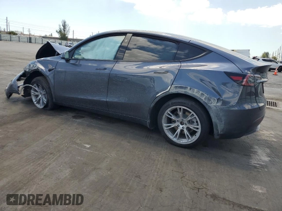 2023 Tesla Model Y Long Range with VIN 7SAYGDEE9PF885405, listed as a Copart auction lot 52858105 with 23,424 mi miles and Non Repairable. Bid and sale history available at DreamBid. Image 2.