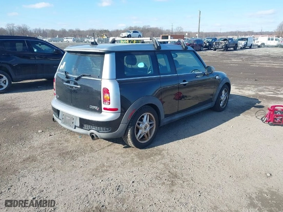2009 MINI Cooper Clubman S with VIN WMWMM33559TP74672, listed as a IAAI auction lot 41352619 with 163,129 mi miles. Bid and sale history available at carsss.com. Image 4.