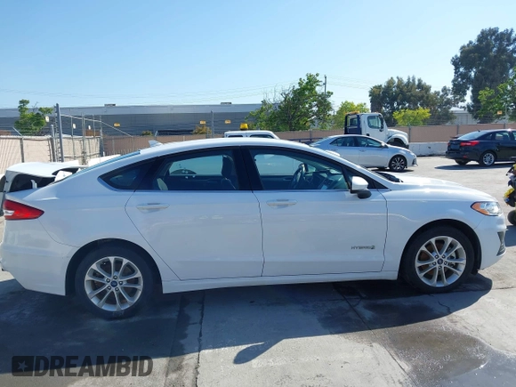 2019 Ford Fusion Hybrid SE with VIN 3FA6P0LU9KR207824, listed as a IAAI auction lot 42153330 with 69,966 mi miles. Bid and sale history available at carsss.com. Image 13.