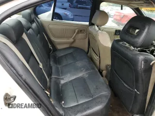 1999 Infiniti G20 z VIN JNKCP11A8XT019442, wystawiony jako Copart lot #66429804 z przebiegiem 209 367 mil mil oraz Szkody całkowita. Historia ofert i sprzedaży dostępna na DreamBid. Obrazek 10.
