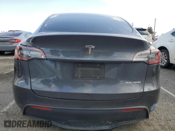 2021 Tesla Model Y Long Range with VIN 5YJYGDEE6MF200883, listed as a Copart auction lot 51707405 with 59,820 mi miles and Salvage Title. Bid and sale history available at DreamBid. Image 6.