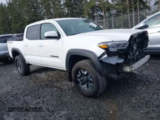 2023 Toyota Tacoma 4WD SR with VIN 3TMCZ5AN2PM641880, listed as a IAAI auction lot 41914417 with 5,128 mi miles. Bid and sale history available at carsss.com. Image 1.