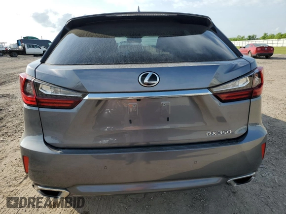 2019 Lexus RX 350 z VIN 2T2ZZMCA9KC129707, wystawiony jako Copart lot #52202615 z przebiegiem 69 868 mil mil oraz Szkoda całkowita • Salvage title. Historia ofert i sprzedaży dostępna na DreamBid. Obrazek 6.
