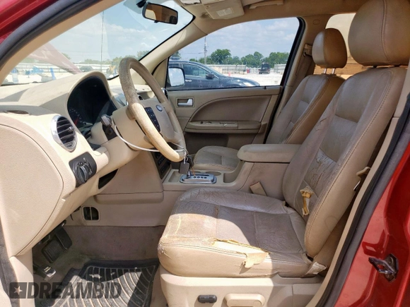 2005 Ford Freestyle SE with VIN 1FMZK01105GA54885, listed as a Copart auction lot 58414145 with 306,275 mi miles and Salvage title. Bid and sale history available at DreamBid. Image 7.