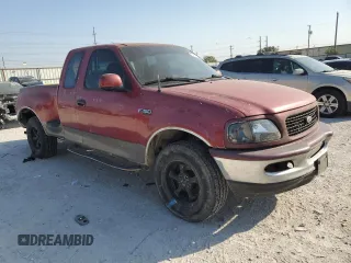 1997 Ford F-150 XL with VIN 1FTDX0721VKC14947, listed as a Copart auction lot 74887414 with 157,811 mi miles and Salvage title. Bid and sale history available at DreamBid. Image 4.