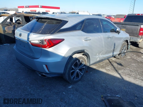 2018 Lexus RX 350 z VIN 2T2ZZMCA6JC096728, wystawiony jako IAAI lot #41356629 z przebiegiem 76 982 mil mil oraz . Historia ofert i sprzedaży dostępna na DreamBid. Obrazek 4.