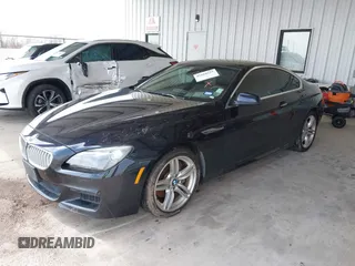 2012 BMW 6 Series 650i z VIN WBALX3C51CDV77602, wystawiony jako IAAI lot #41668235 z przebiegiem 103 684 mil mil oraz . Historia ofert i sprzedaży dostępna na DreamBid. Obrazek 17.