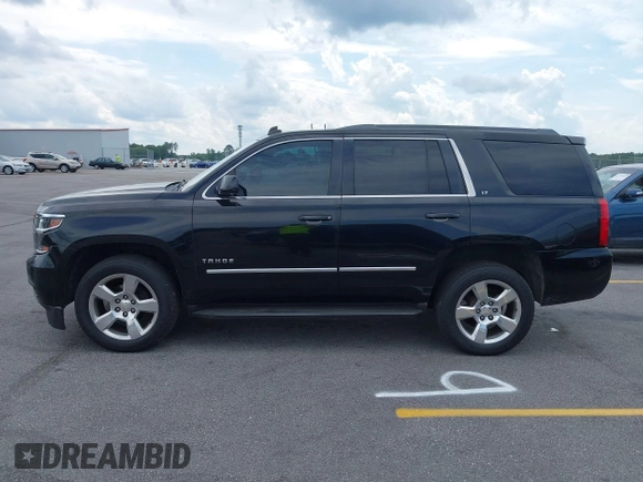 2015 Chevrolet Tahoe LT with VIN 1GNSCBKC4FR145119, listed as a IAAI auction lot 42309931 with 99,408 mi miles and . Bid and sale history available at DreamBid. Image 14.