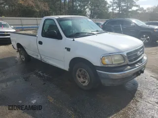 2003 Ford F-150 XL with VIN 1FTRF17W33NA54471, listed as a Copart auction lot 42594765 with 134,409 mi miles and Salvage Title. Bid and sale history available at DreamBid. Image 4.