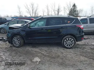 2018 Ford Escape Titanium with VIN 1FMCU0J90JUD17085, listed as a IAAI auction lot 41699687 with Not provided miles and . Bid and sale history available at DreamBid. Image 14.