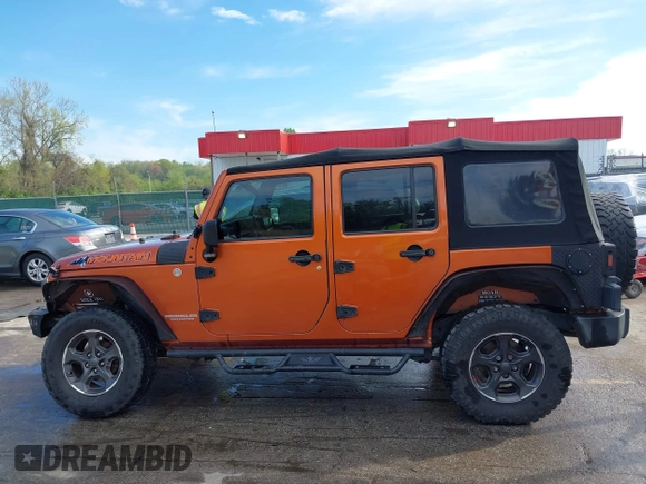 2010 Jeep Wrangler Unlimited Sport with VIN 1J4HA3H1XAL189667, listed as a IAAI auction lot 42062351 with 144,838 mi miles. Bid and sale history available at carsss.com. Image 14.